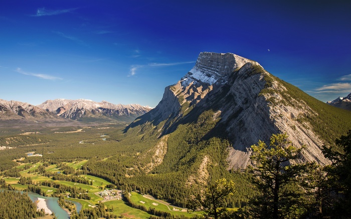 Mountain landscape with golf course and river
