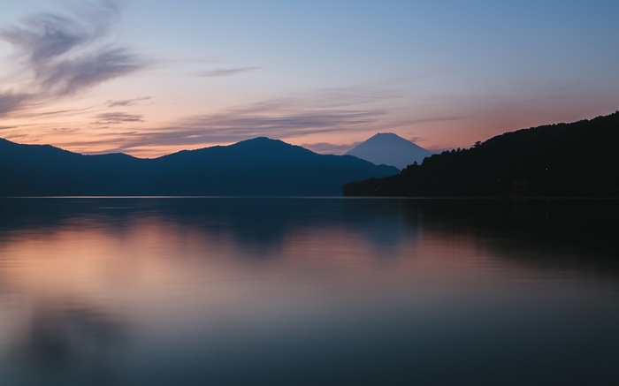Lake and mountains at dusk with Mount Fuji