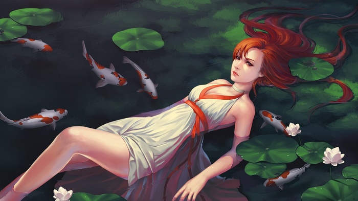 Redhead woman lying in a pond with koi fish
