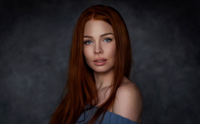 Portrait of a redhead woman with blue eyes