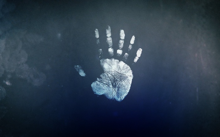 Handprint on a dark surface