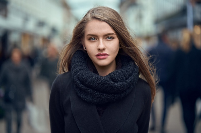 Woman with scarf and black coat