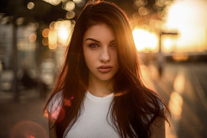 Portrait of a woman with sunlight and lens flare