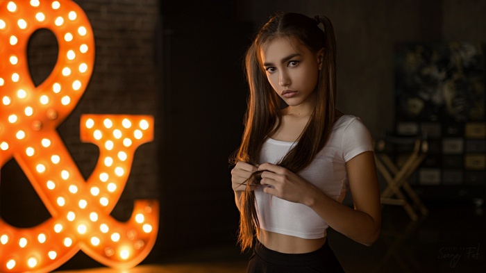 Anastasia Lis posing with a marquee sign