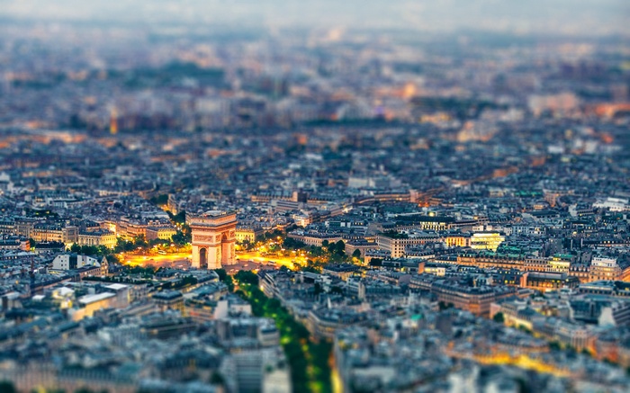 Paris cityscape with Arc de Triomphe at dusk