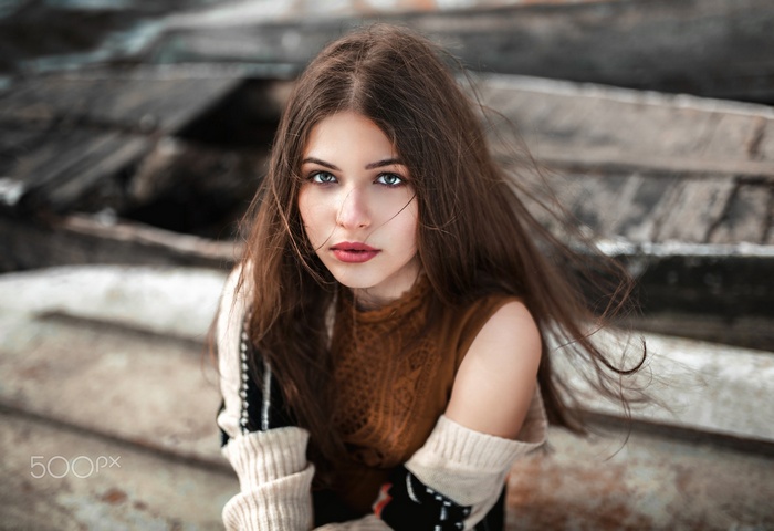 Portrait of a young woman with long brown hair