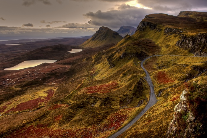 Scottish Highlands landscape with winding road and lochs