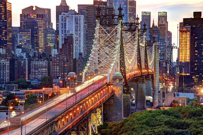 Queensboro Bridge at dusk with Manhattan skyline