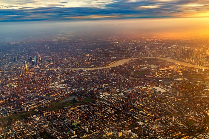 Aerial view of London at sunrise with River Thames