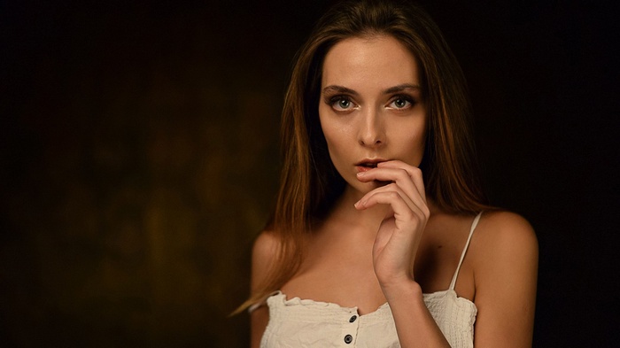 Woman with finger on lips