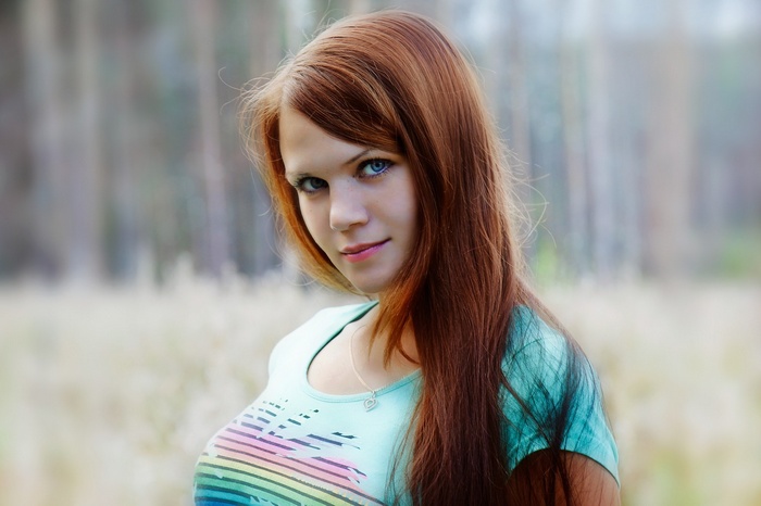 Redhead woman with blue eyes outdoors
