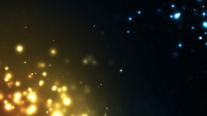 Yellow and blue floating particles on a dark background