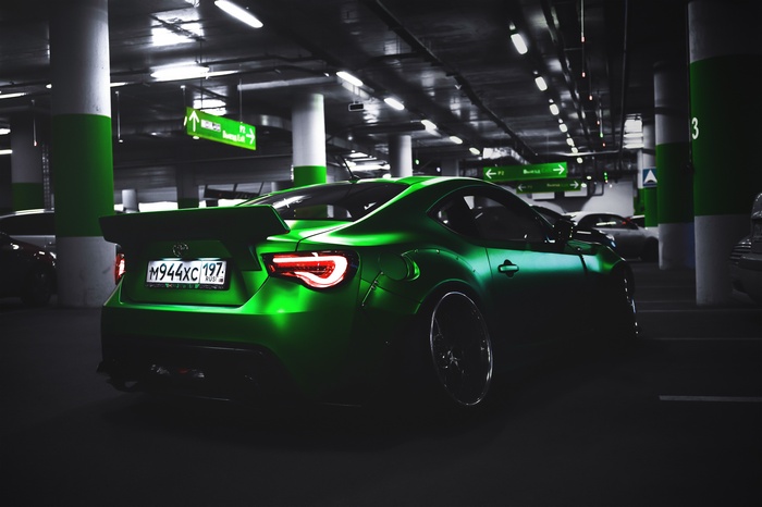 Green Toyota GT86 with LB Works kit in parking garage