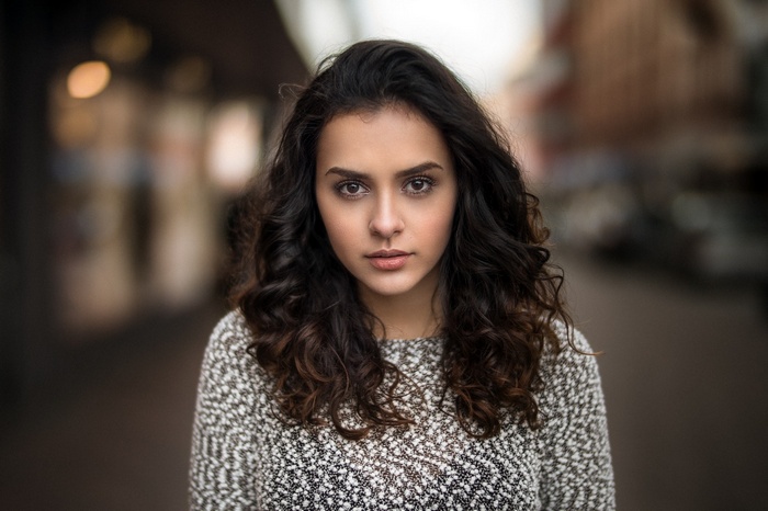 Portrait of a young woman with curly hair