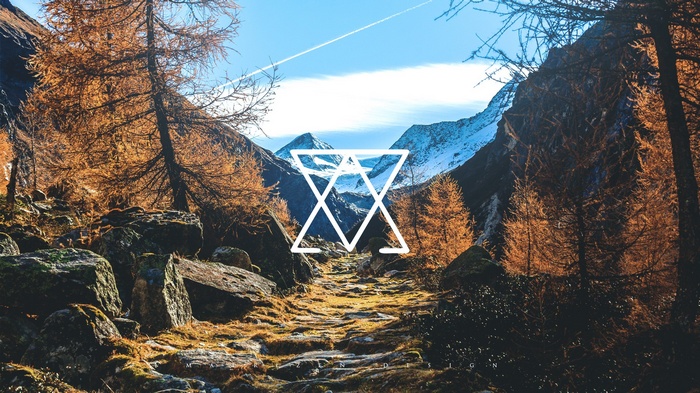 Geometric symbol over autumn mountain landscape