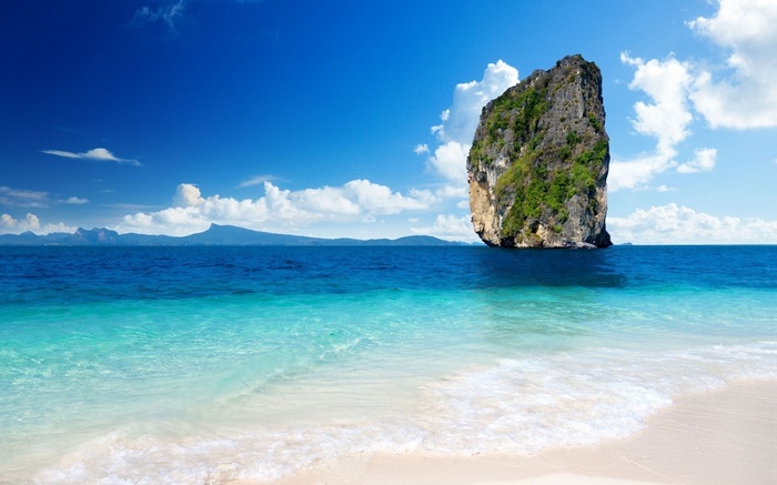 Tropical island rock formation in the ocean