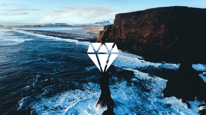 Diamond logo over Icelandic coast with waves and mountains