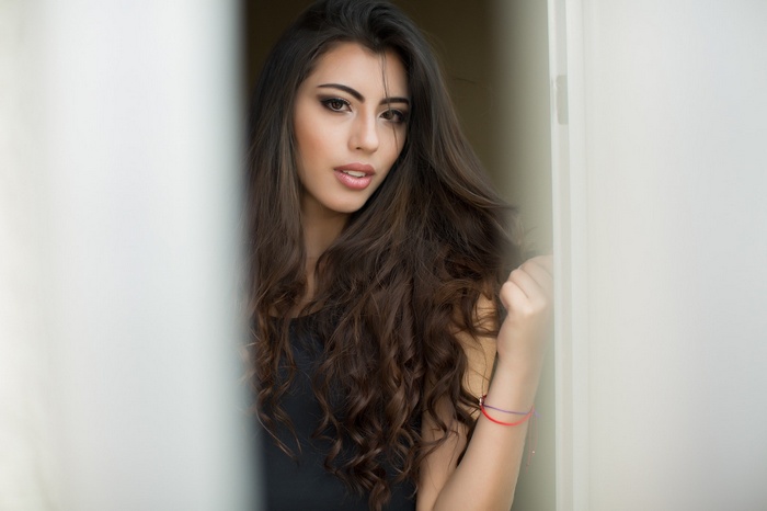 Woman with long wavy brown hair