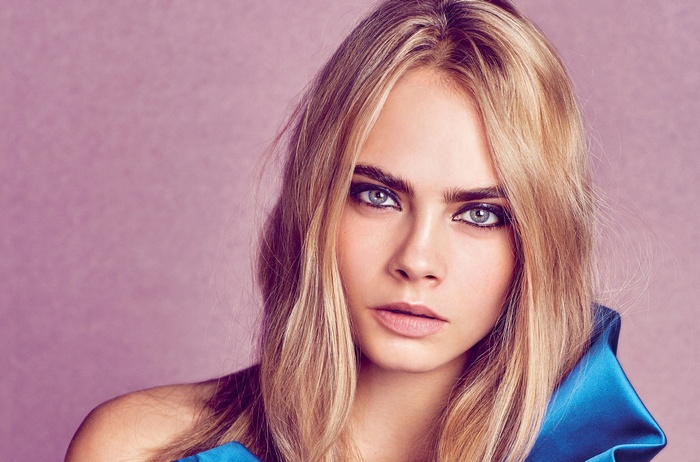 Cara Delevingne portrait with blonde hair and makeup