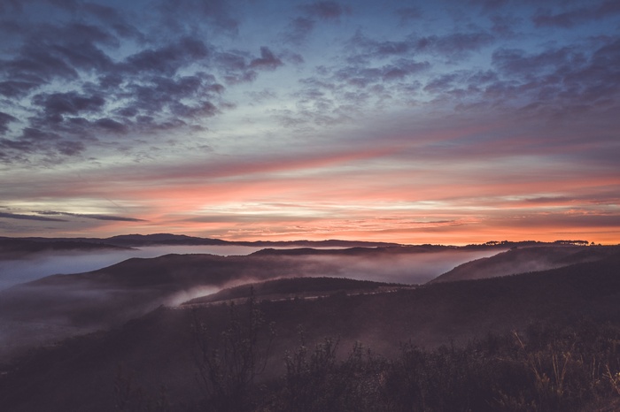 Misty mountains at sunrise with colorful sky