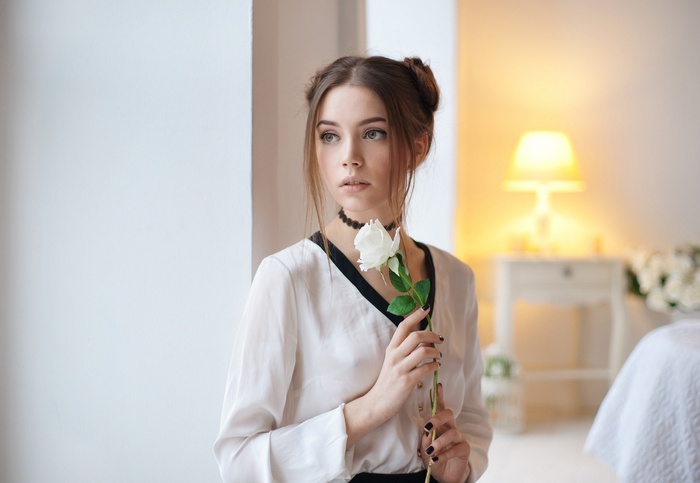 Woman with white rose and choker
