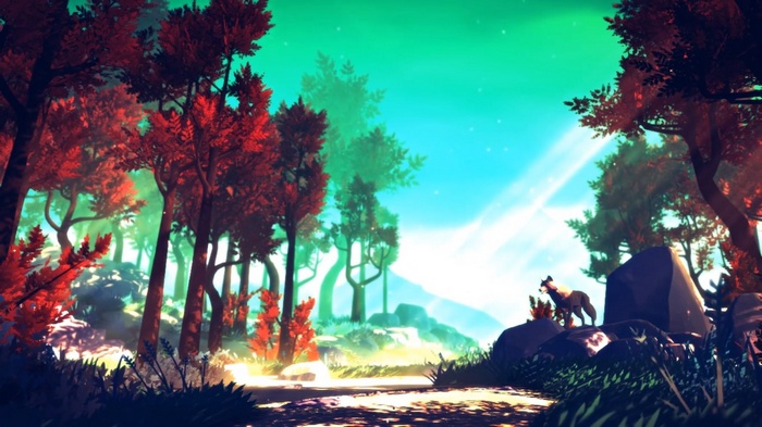 A wolf stands on rocks in a colorful forest