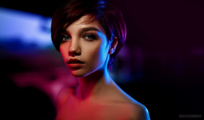 Portrait of Olya Pushkina with short hair and piercing