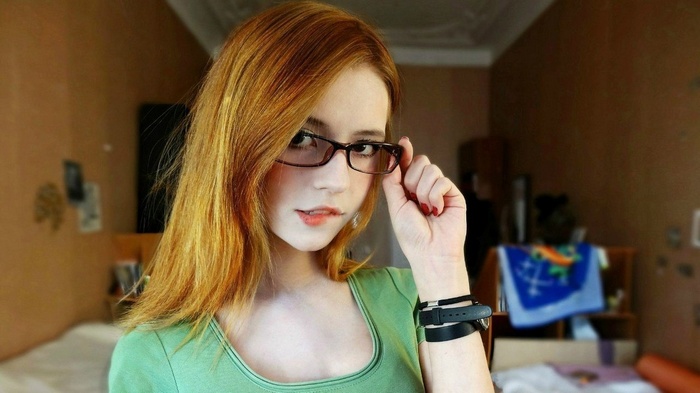 Lina Merkalina with glasses biting lip