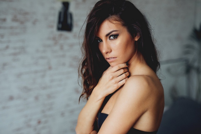 Woman with dark hair and makeup