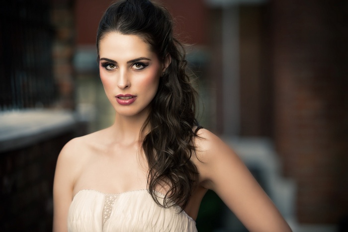 Woman with dark hair and makeup
