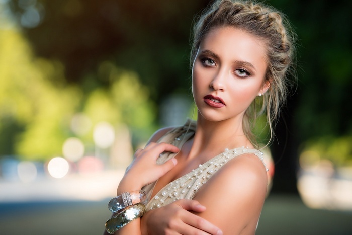 Woman with braided hair and bracelets