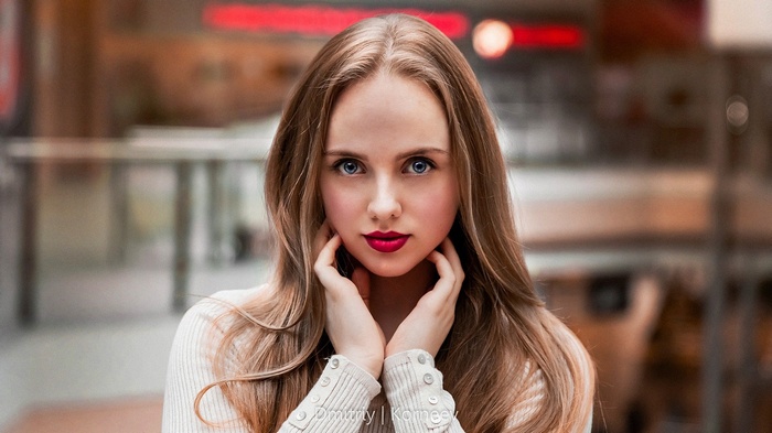 Woman with long blonde hair and blue eyes