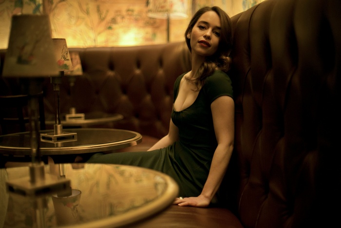 Emilia Clarke sitting in a booth