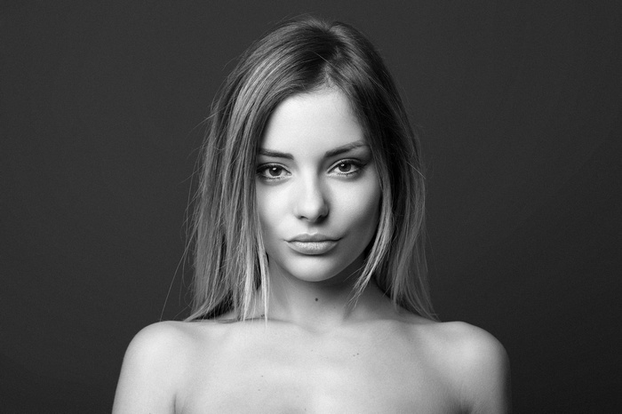 Monochrome portrait of a woman with bare shoulders