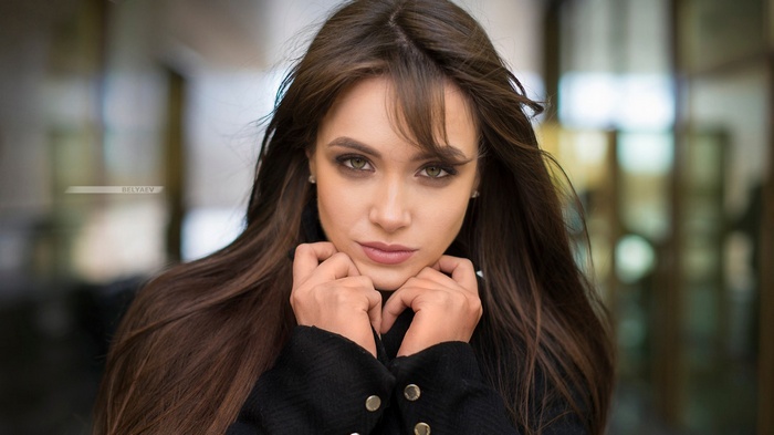 Portrait of a woman with long brown hair
