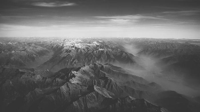 Aerial view of snow-capped mountains and valleys