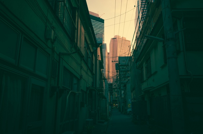 Alleyway between buildings with skyscrapers in Japan
