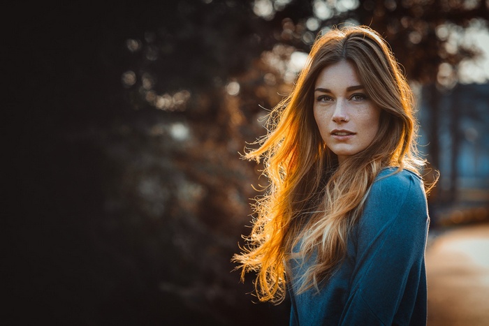 Woman with blonde hair and nose ring outdoors