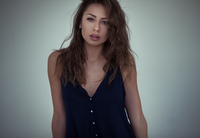 Woman in a dark blue tank top