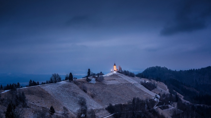 Church on a hill in Slovenia at dusk