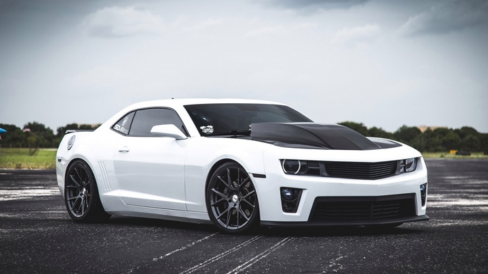 White Chevrolet Camaro SS with custom hood and wheels