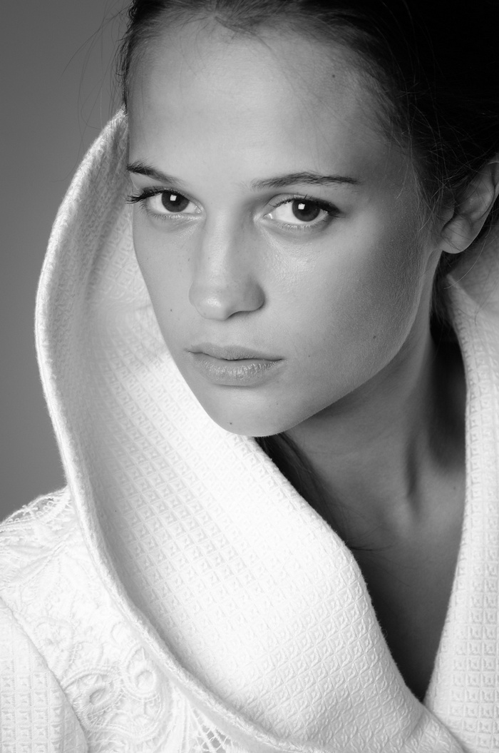Alicia Vikander in a white robe