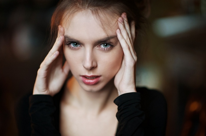 Portrait of Victoria Vishnevetskaya with hands on temples