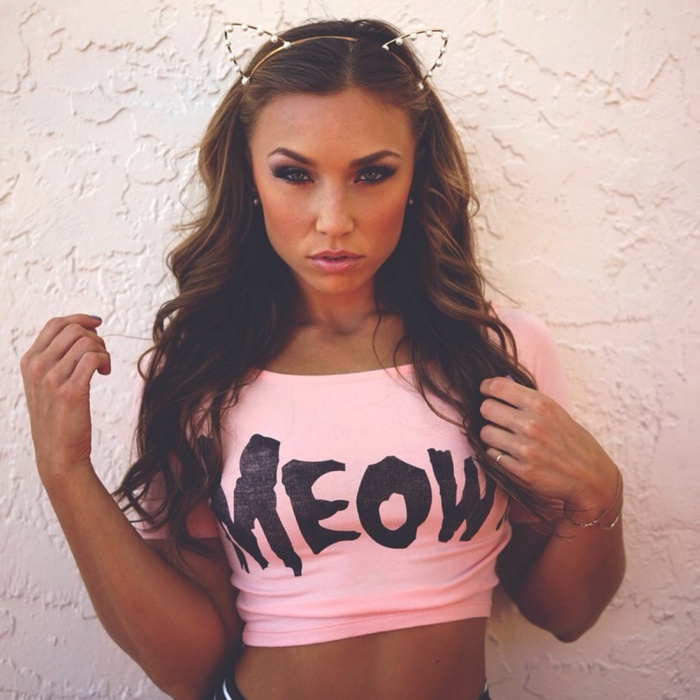 Nicole Mejia wearing a pink crop top with 'MEOW' text