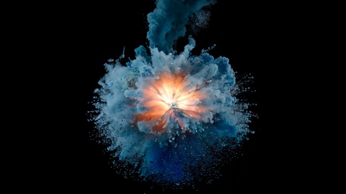 Explosion of blue and orange powder