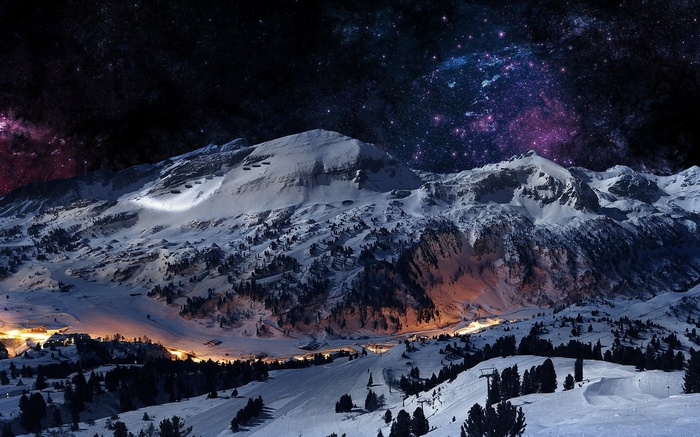 Snowy mountains under a starry night sky