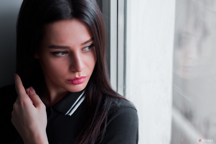 Woman looking out a window