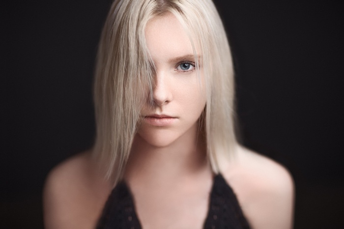 Woman with blonde hair and blue eyes