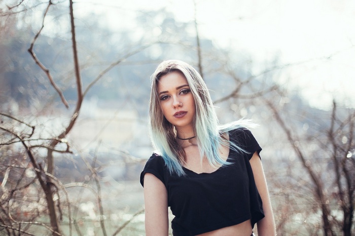 Woman with dyed hair and nose ring outdoors