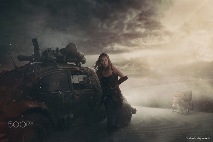 Woman with modified car in apocalyptic desert